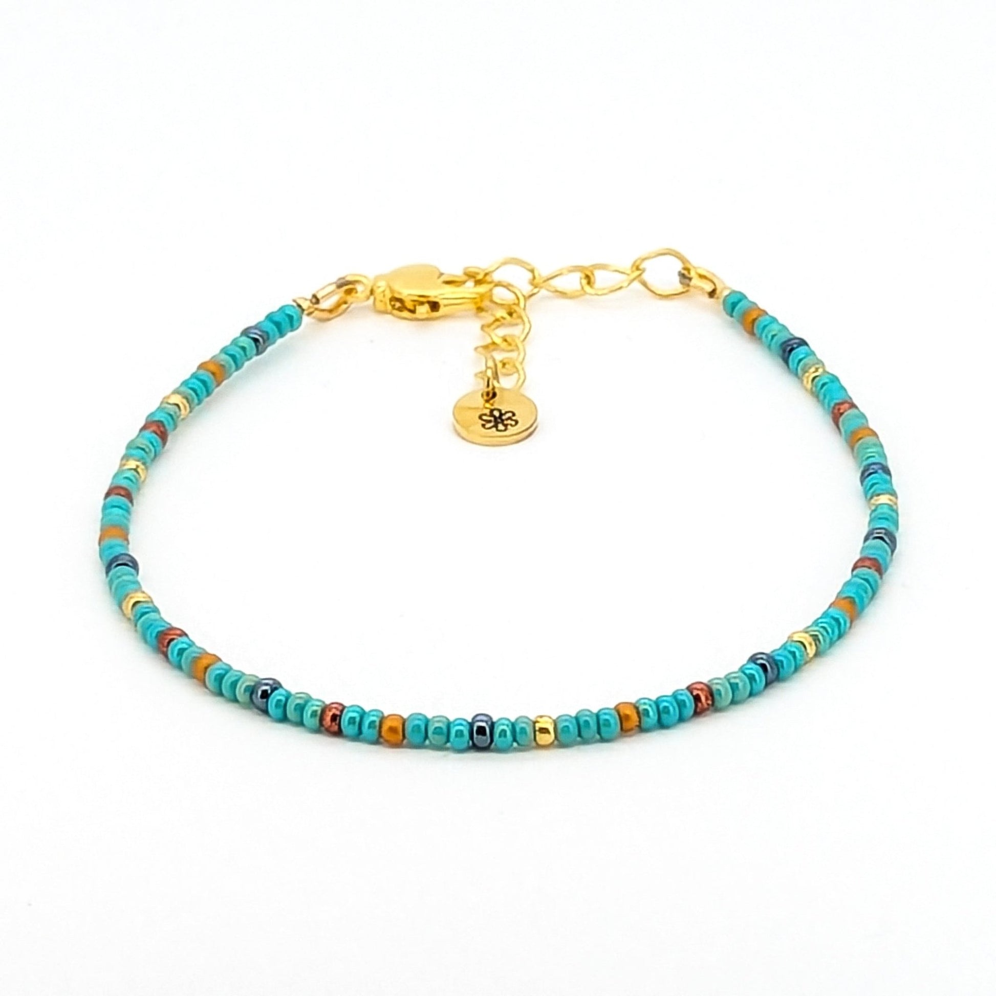 Dainty bracelet - turquoise, gunmetal, gold and copper glass seed beads - creations by cherie